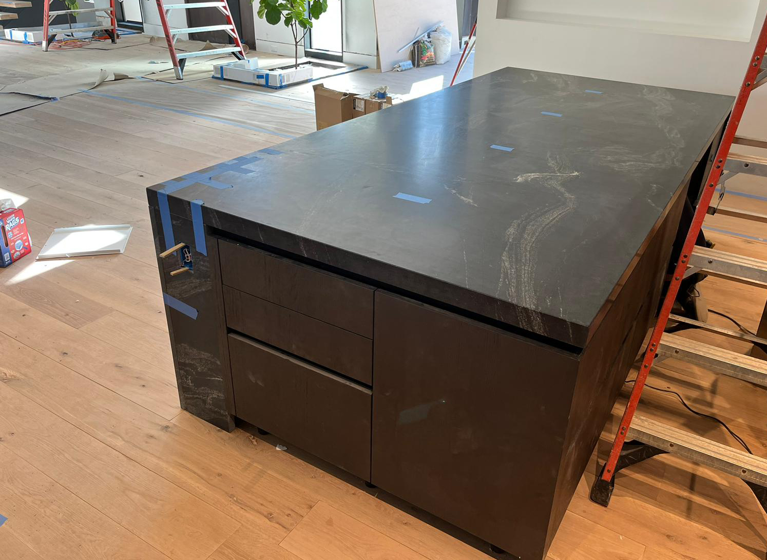 New project kitchen remodel , European cabinetry with black leather quartzite tops and black stucco back splash