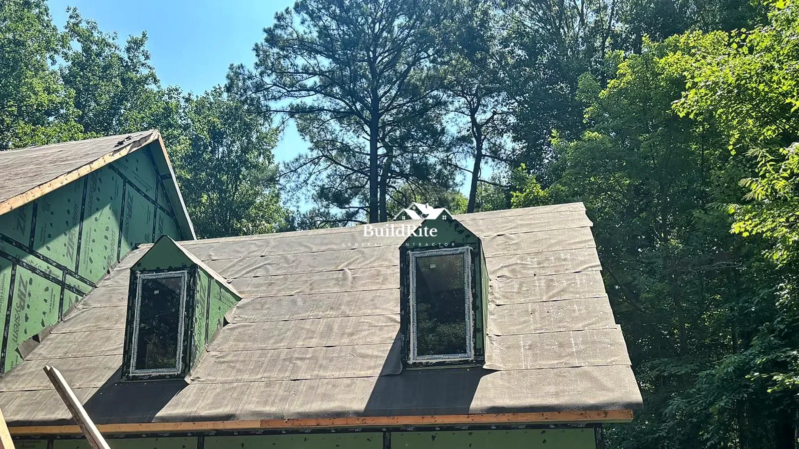 Dormer windows installed above a garage during an Apex NC exterior construction project