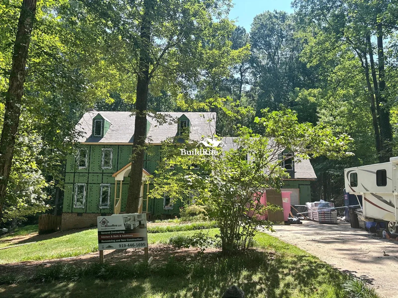 BuildRite residential construction jobsite with European windows roofing and exterior envelope work in Apex NC